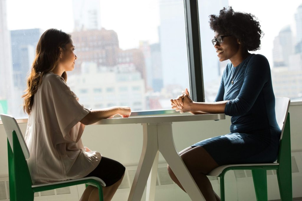 Two women having a professional conversation together